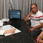 Doctor reassuring a patient her diagnosis remains valid