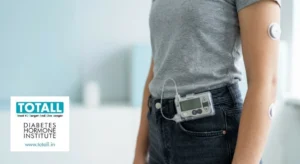 AI insulin pump with CGM sensor worn on the arm, explained by TOTALL Diabetes Hormone Institute Indore